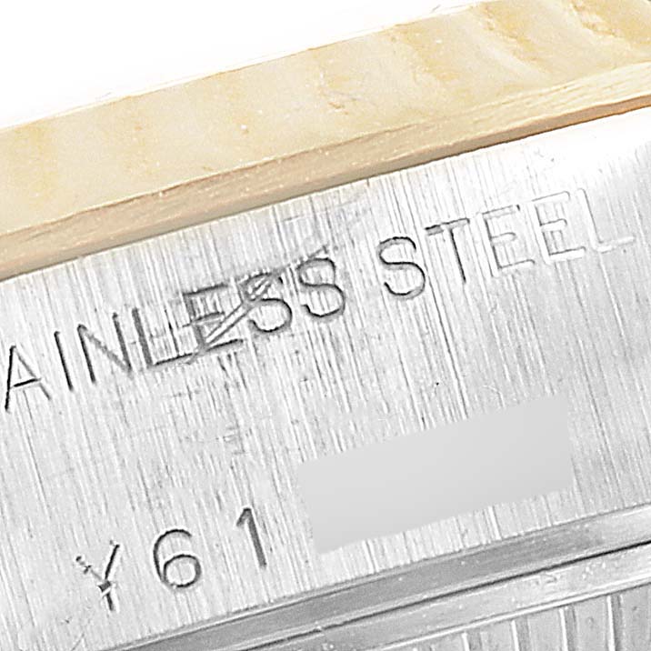 This close-up shows the "STAINLESS STEEL" engraving on the Rolex Datejust 79173 Women's Steel and Gold (two tone) White Dial 79173 Women's Steel and Gold (two tone) White Dial watch.