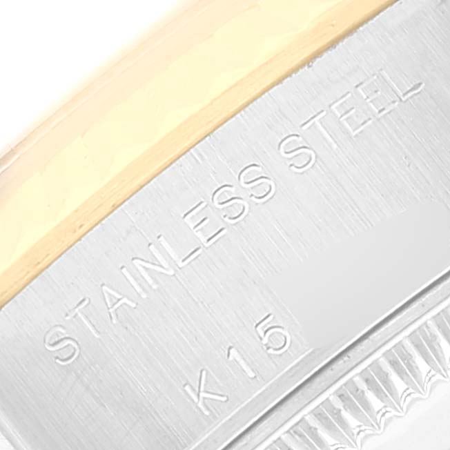 This is a close-up of the stainless steel back and fluted bezel of a Rolex Datejust 79173 Women's Steel and Gold (two tone) White Dial 79173 Women's Steel and Gold (two tone) White Dial watch.