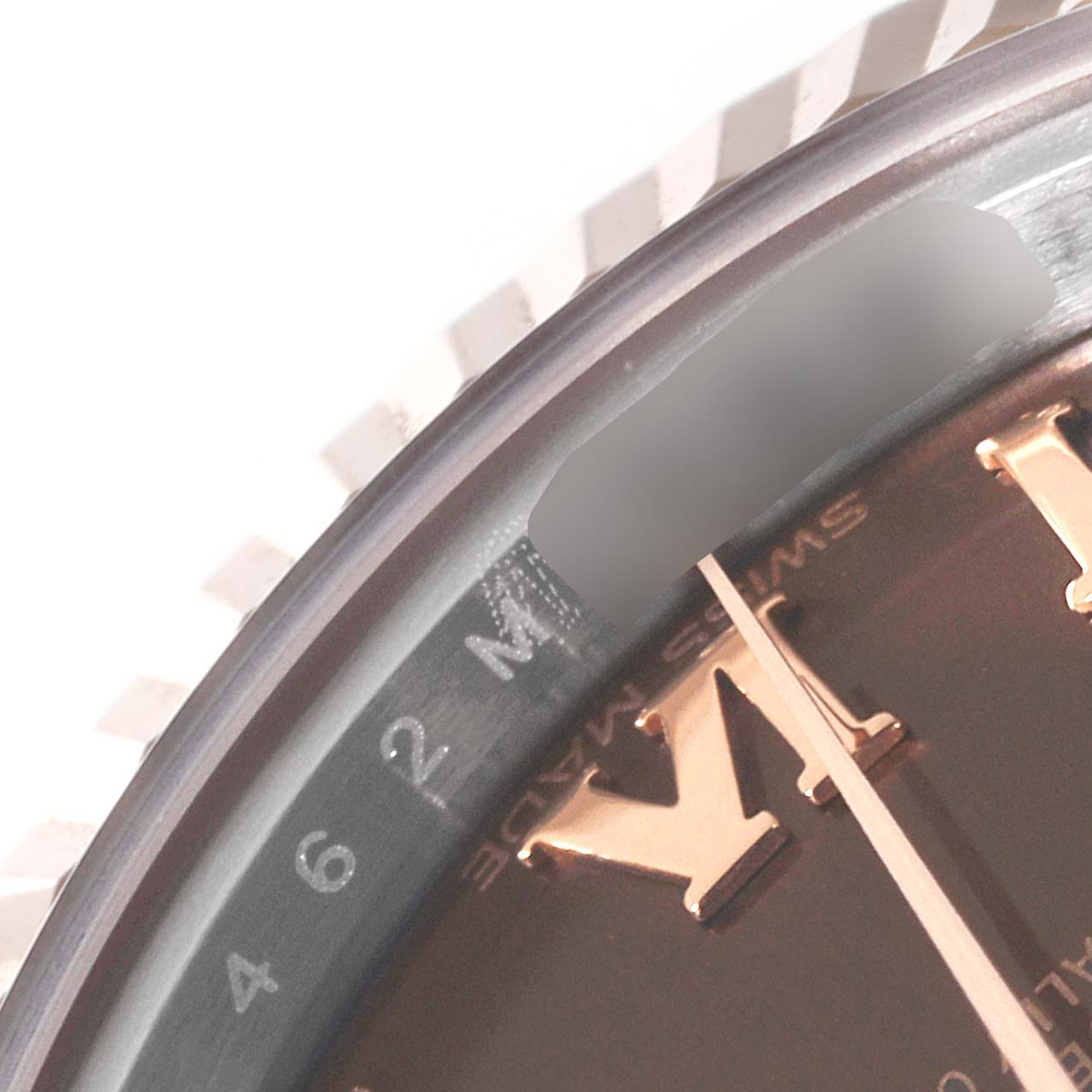 The image shows a close-up angle of the Roman numeral markers and part of the bezel of a Rolex Datejust 279171 Women's Steel and Gold (two tone) Brown Dial 279171 Women's Steel and Gold (two tone) Brown Dial watch.