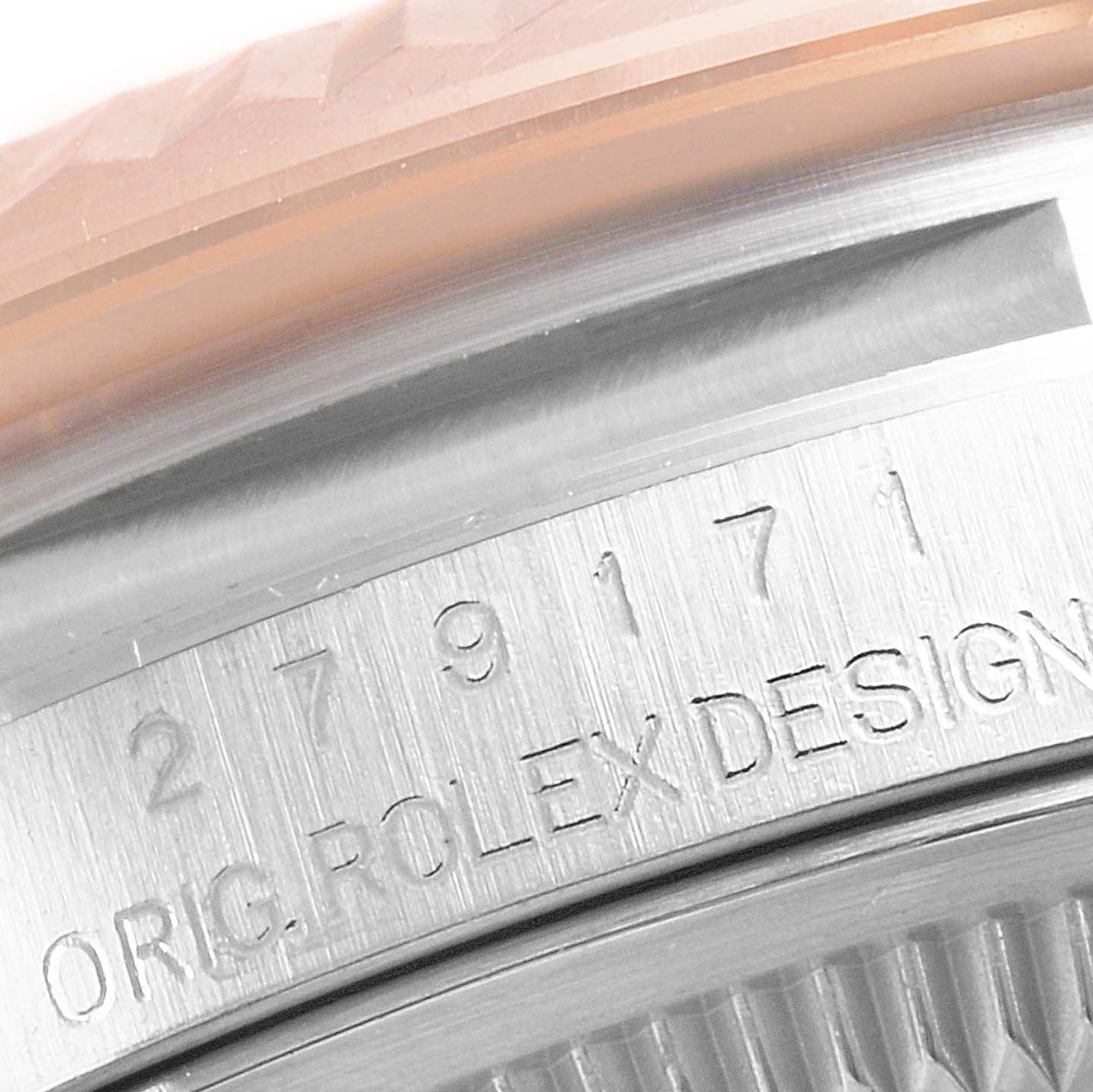 The image shows a close-up of the serial number engraving on the side of a Rolex Datejust 279171 Women's Steel and Gold (two tone) Brown Dial 279171 Women's Steel and Gold (two tone) Brown Dial watch bezel and case.