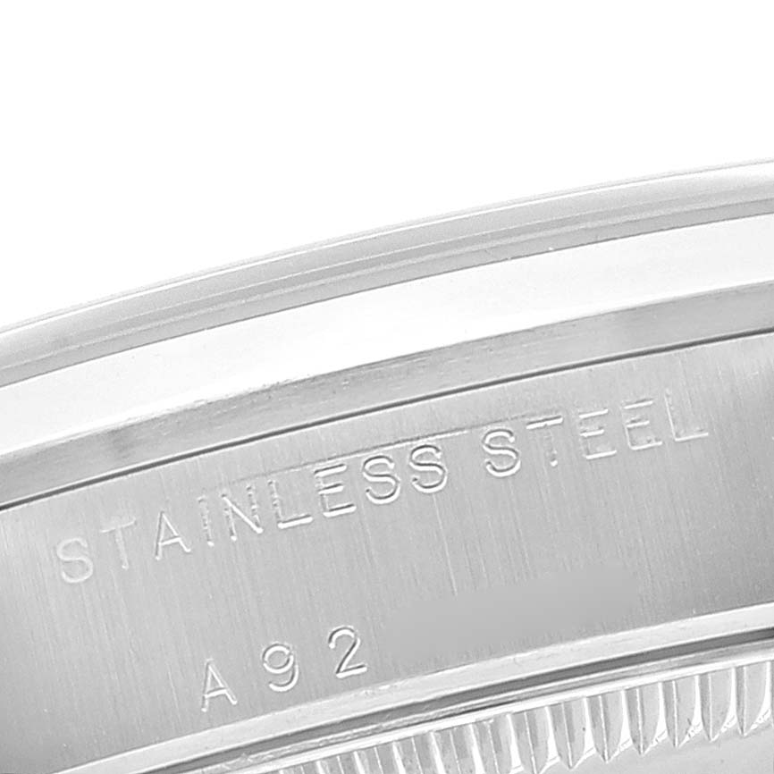 This close-up image shows the stainless steel casing of a Mid-Size Rolex watch.
