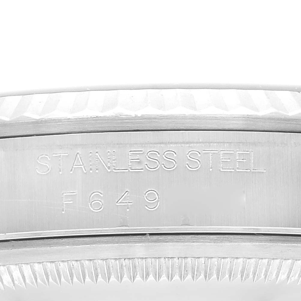 The image shows a close-up of the stainless steel case with engraved markings on a Rolex Datejust 16234 Men's Stainless Steel Silver Dial 16234 Men's Stainless Steel Silver Dial watch.