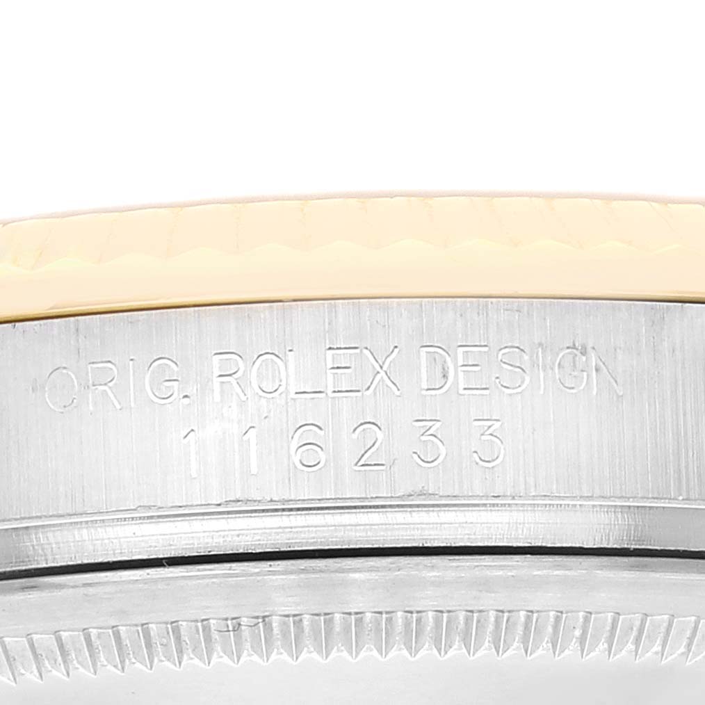 The image shows the side of the case and the bezel of a Rolex Datejust 116233 Men's Steel and Gold (two tone) Champagne Dial 116233 Men's Steel and Gold (two tone) Champagne Dial watch, focusing on the engraved "ROLEX DESIGN" and model number.