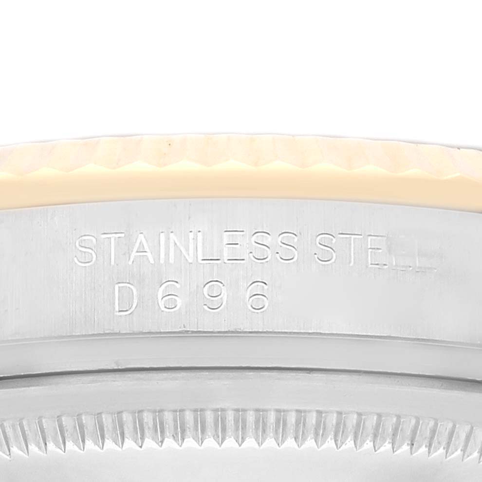 The image shows the stainless steel case back with engraved text of a Rolex Datejust 116233 Men's Steel and Gold (two tone) Champagne Dial 116233 Men's Steel and Gold (two tone) Champagne Dial watch.