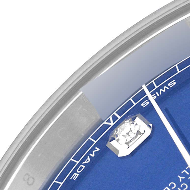 This close-up image of a Rolex Datejust 41 126334 Men
s Stainless Steel Blue Dial 126334 Men
s Stainless Steel Blue Dial shows part of the blue dial, a diamond hour marker, and the "Swiss Made" text.