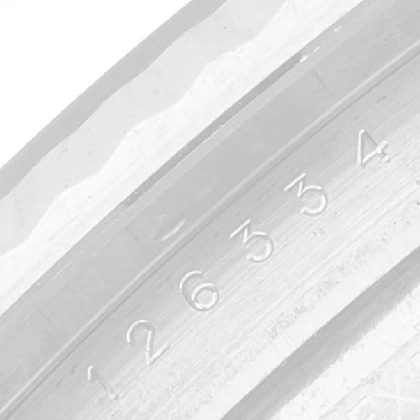 This is a close-up image showing the engraved serial number on the inner bezel of a Rolex Datejust 41 126334 Men
s Stainless Steel Blue Dial 126334 Men
s Stainless Steel Blue Dial watch.