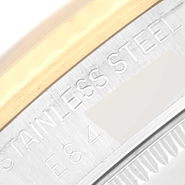 This image shows a close-up of the case back of a Rolex Mid-Size 68273 Women's Steel and Gold (two tone) Champagne Dial 68273 Women's Steel and Gold (two tone) Champagne Dial model, highlighting the "Stainless Steel" engraving.
