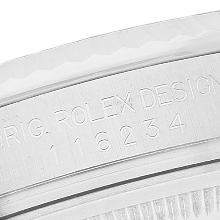 This image shows a close-up angle of the side of the Rolex Datejust 116234 Men's Stainless Steel Black Dial 116234 Men's Stainless Steel Black Dial model, focusing on the engraved serial number and branding.