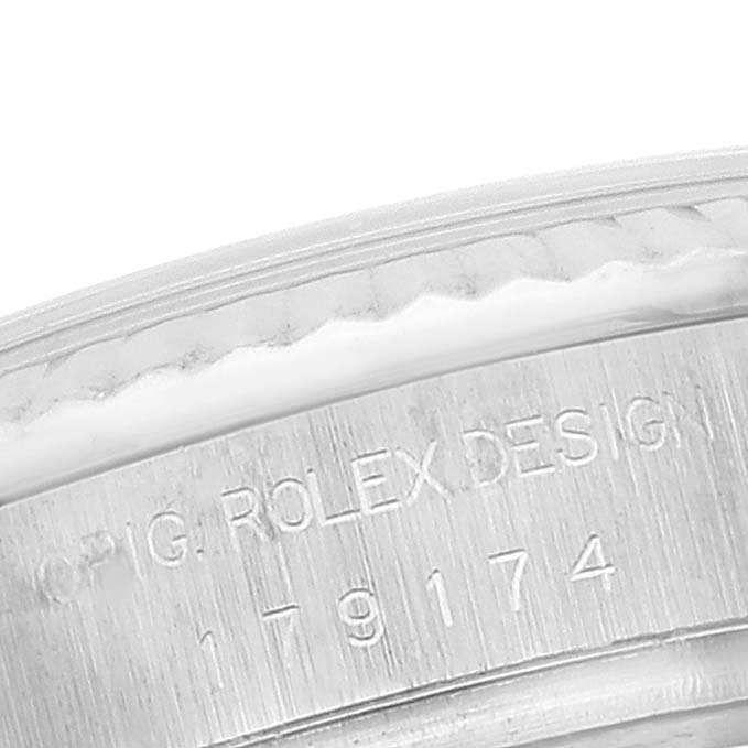The image shows a close-up of the engraved casing of the Rolex Datejust 179174 Women's Stainless Steel Silver Dial 179174 Women's Stainless Steel Silver Dial watch.
