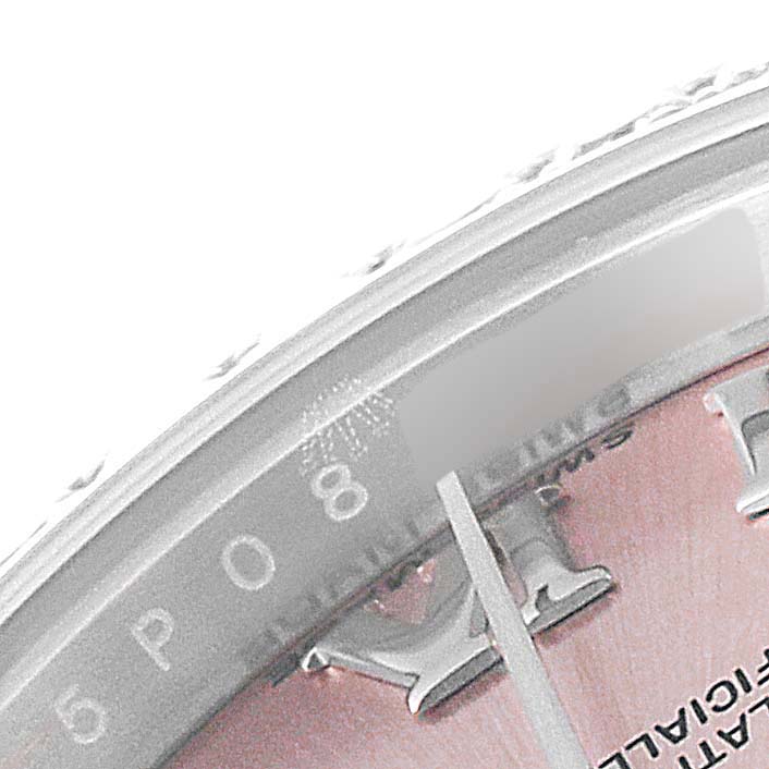 The image shows a close-up of the dial and the minute hand of a Rolex Datejust 179384 Women's Stainless Steel Pink Dial 179384 Women's Stainless Steel Pink Dial watch, focusing on the 8 o'clock position.