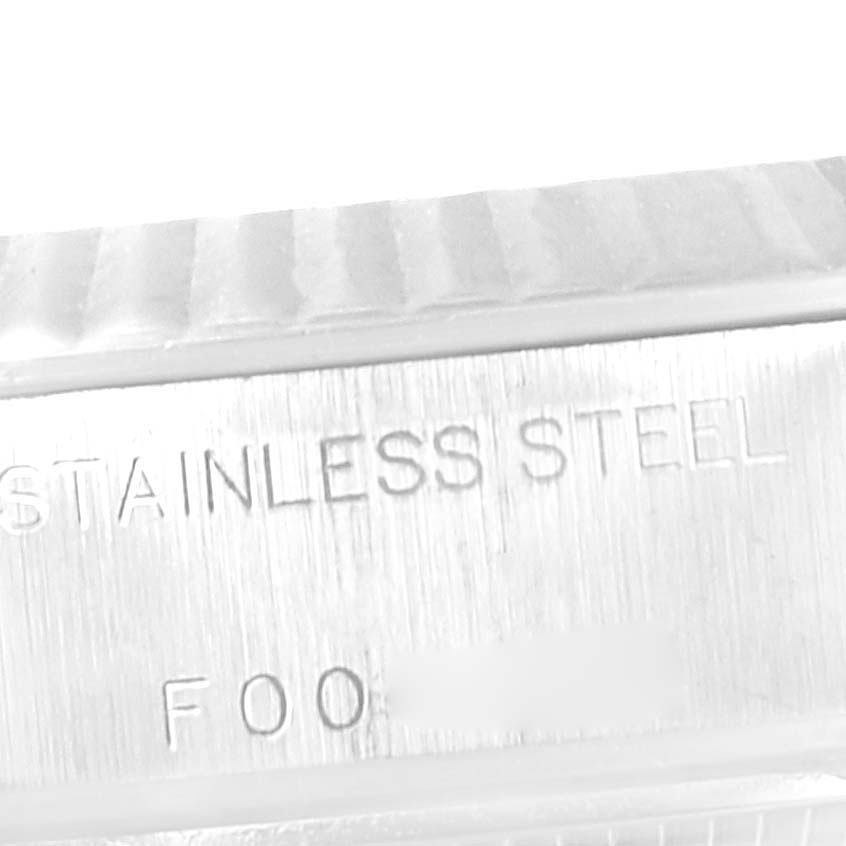 This image shows a close-up of the case back rim of a Rolex Datejust 79174 Women's Stainless Steel White Dial 79174 Women's Stainless Steel White Dial watch, highlighting the "STAINLESS STEEL" engraving.