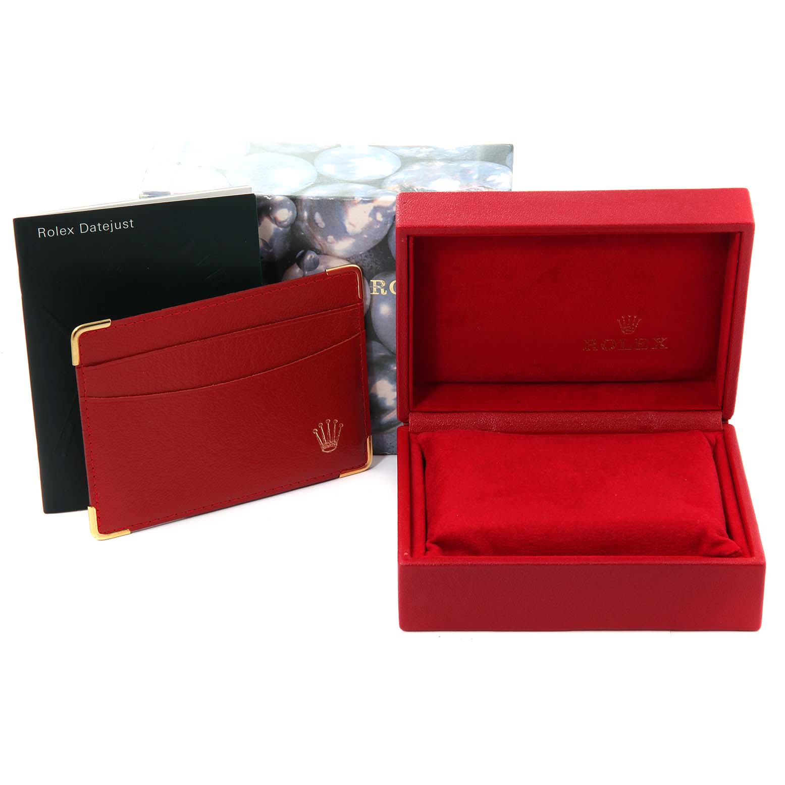 This image shows the accessories of a Rolex Datejust 79174 Women's Stainless Steel White Dial 79174 Women's Stainless Steel White Dial, including a red case, card holder, and an outer box with branding.