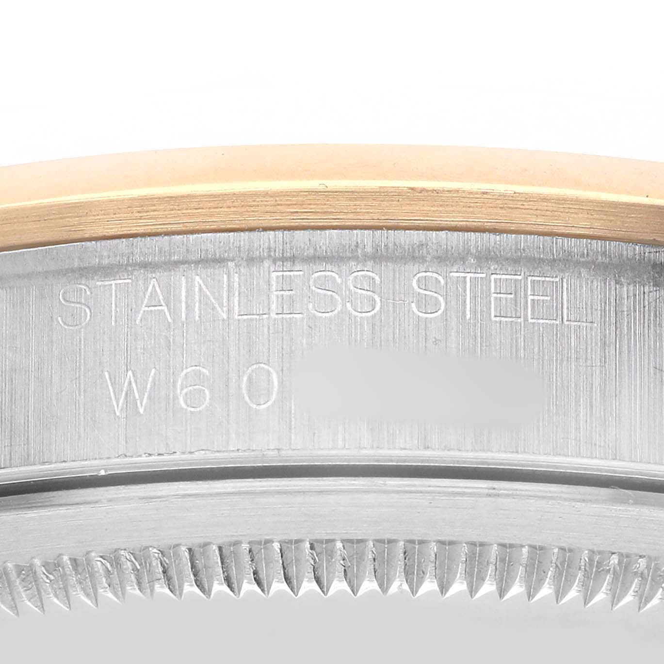 The image shows a close-up of the Rolex Datejust 16203 Men's Steel and Gold (two tone) Black Dial's bezel edge, focusing on the stainless steel and gold detailing.