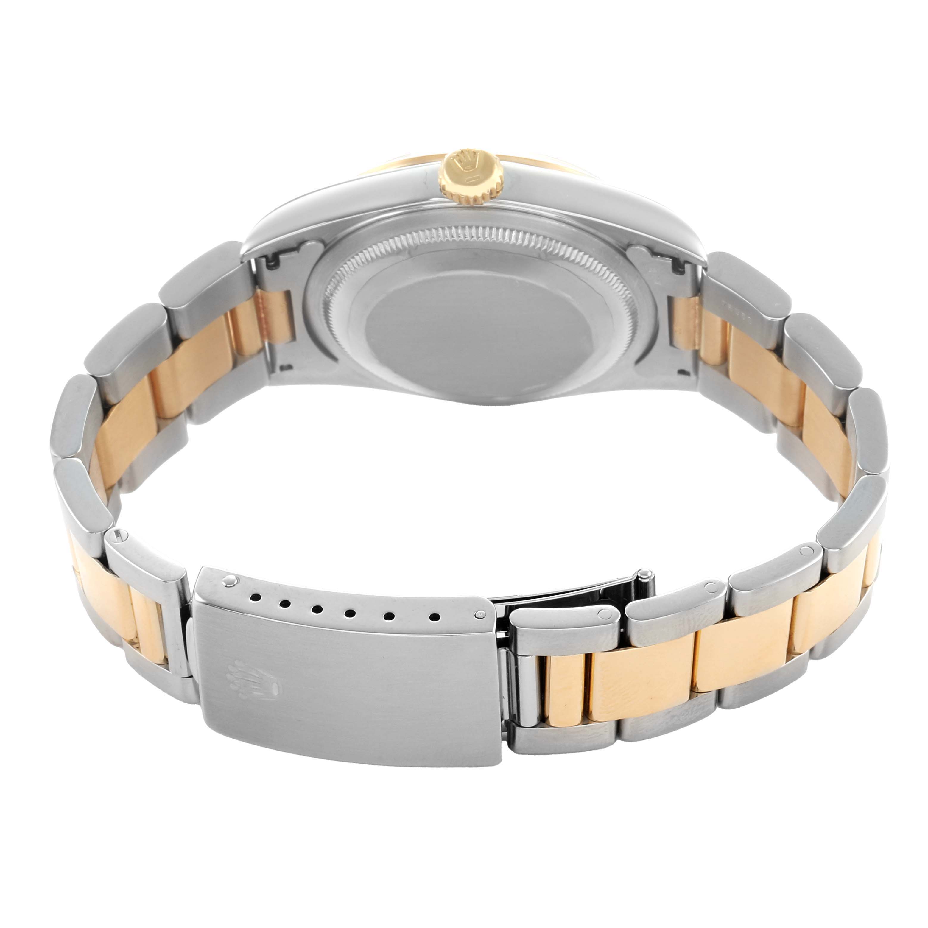 The image shows the back view of a Rolex Datejust 16203 Men's Steel and Gold (two tone) Black Dial, highlighting the clasp, bracelet, and case back.