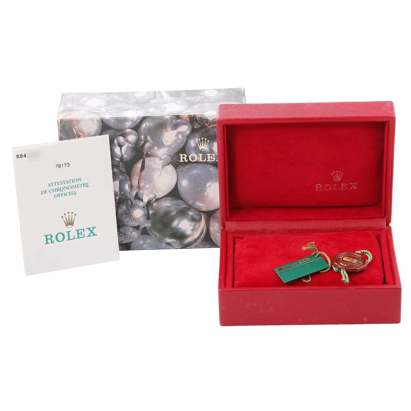 The image shows the box, certificate, and accessory tags for a Rolex Datejust 79173 Women's Steel and Gold (two tone) Silver Dial 79173 Women's Steel and Gold (two tone) Silver Dial model watch.