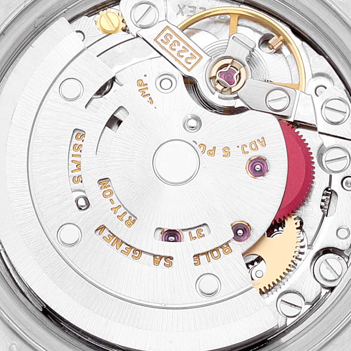 This image shows a close-up of the internal mechanism of a Rolex Datejust 79173 Women's Steel and Gold (two tone) Silver Dial 79173 Women's Steel and Gold (two tone) Silver Dial watch, highlighting gears and movement components.