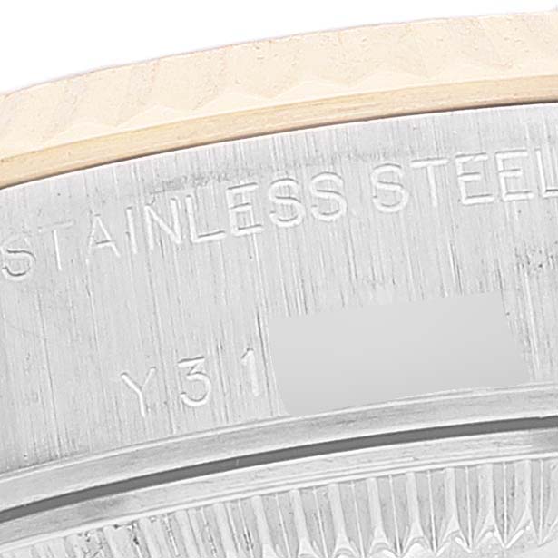 This image shows a close-up of the case back and engraving of a Rolex Datejust 79173 Women's Steel and Gold (two tone) Silver Dial 79173 Women's Steel and Gold (two tone) Silver Dial model watch.