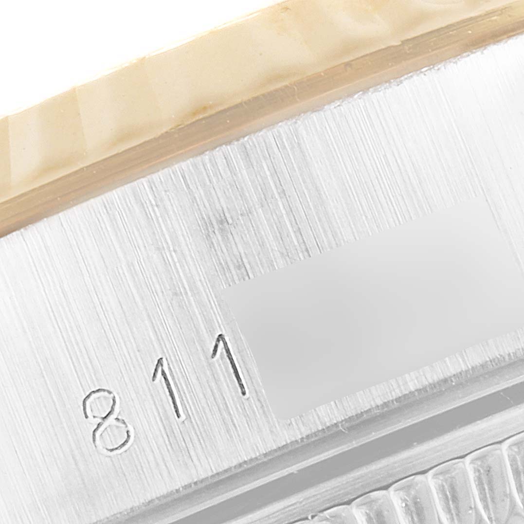 The image shows a close-up angle of the serial number engraved on the side of the Rolex Datejust 69173 Women's Steel and Gold (two tone) Champagne Dial 69173 Women's Steel and Gold (two tone) Champagne Dial watch case.