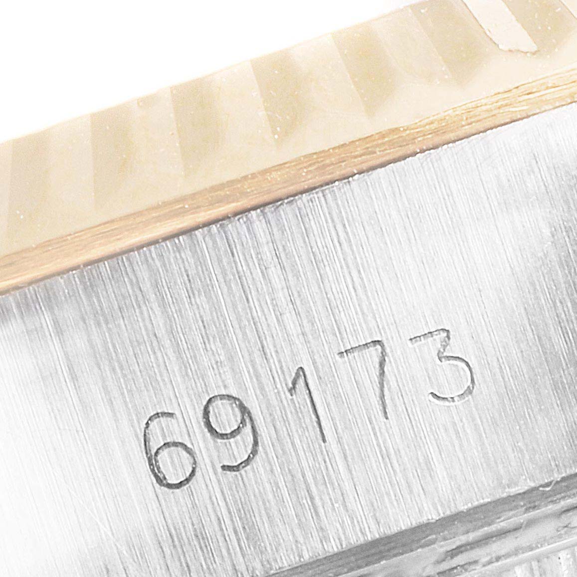 The image shows a close-up of the serial number "69173" on the case of a Rolex Datejust 69173 Women's Steel and Gold (two tone) Champagne Dial 69173 Women's Steel and Gold (two tone) Champagne Dial watch, highlighting the bezel and case.