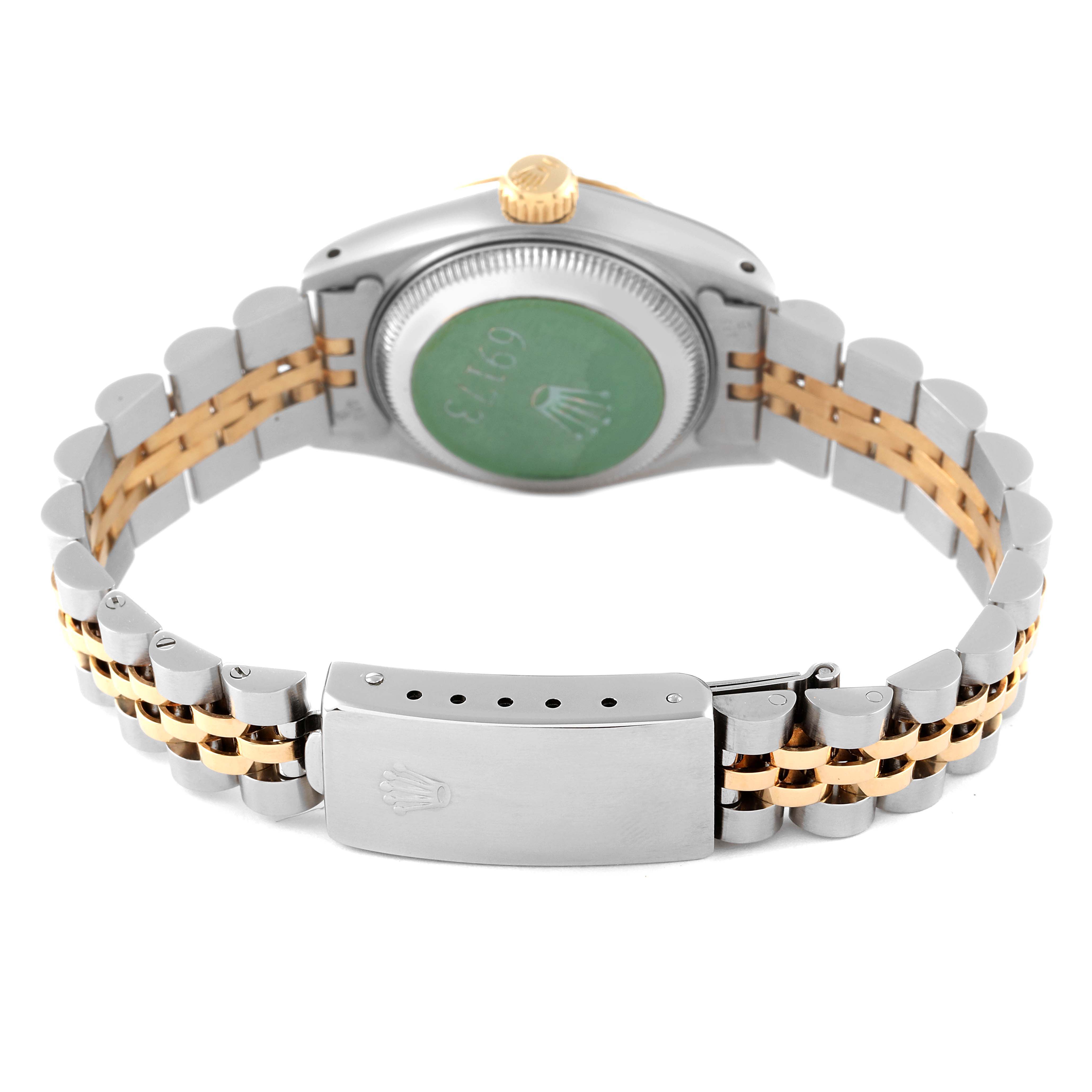 The image shows the backside and clasp of a Rolex Datejust 69173 Women's Steel and Gold (two tone) White Dial 69173 Women's Steel and Gold (two tone) White Dial watch, highlighting its two-tone metal bracelet and case back.