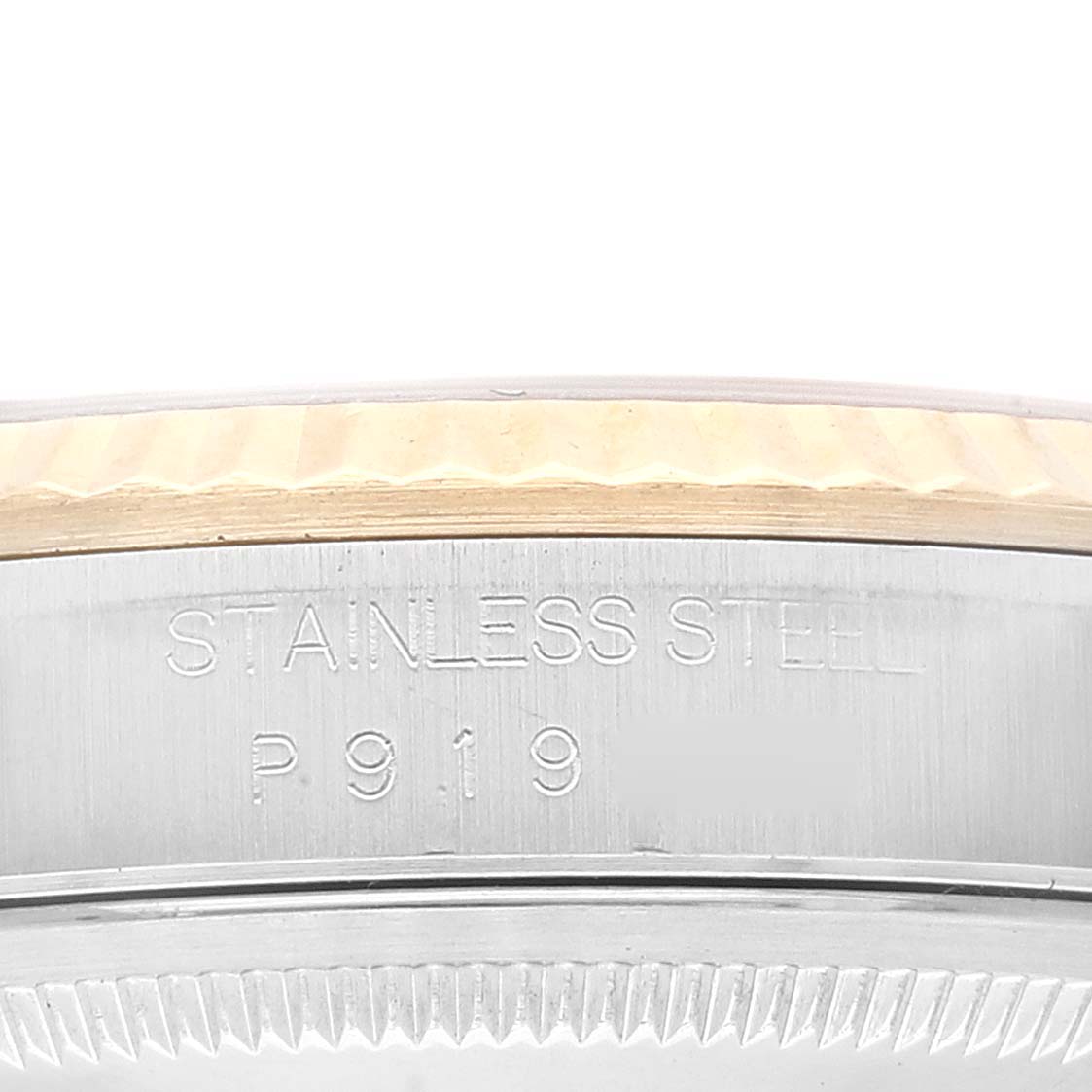 The image shows a close-up of the side engraving and edge of the bezel of a Rolex Datejust 16233 Men's Steel and Gold (two tone) Silver Dial 16233 Men's Steel and Gold (two tone) Silver Dial watch in stainless steel.