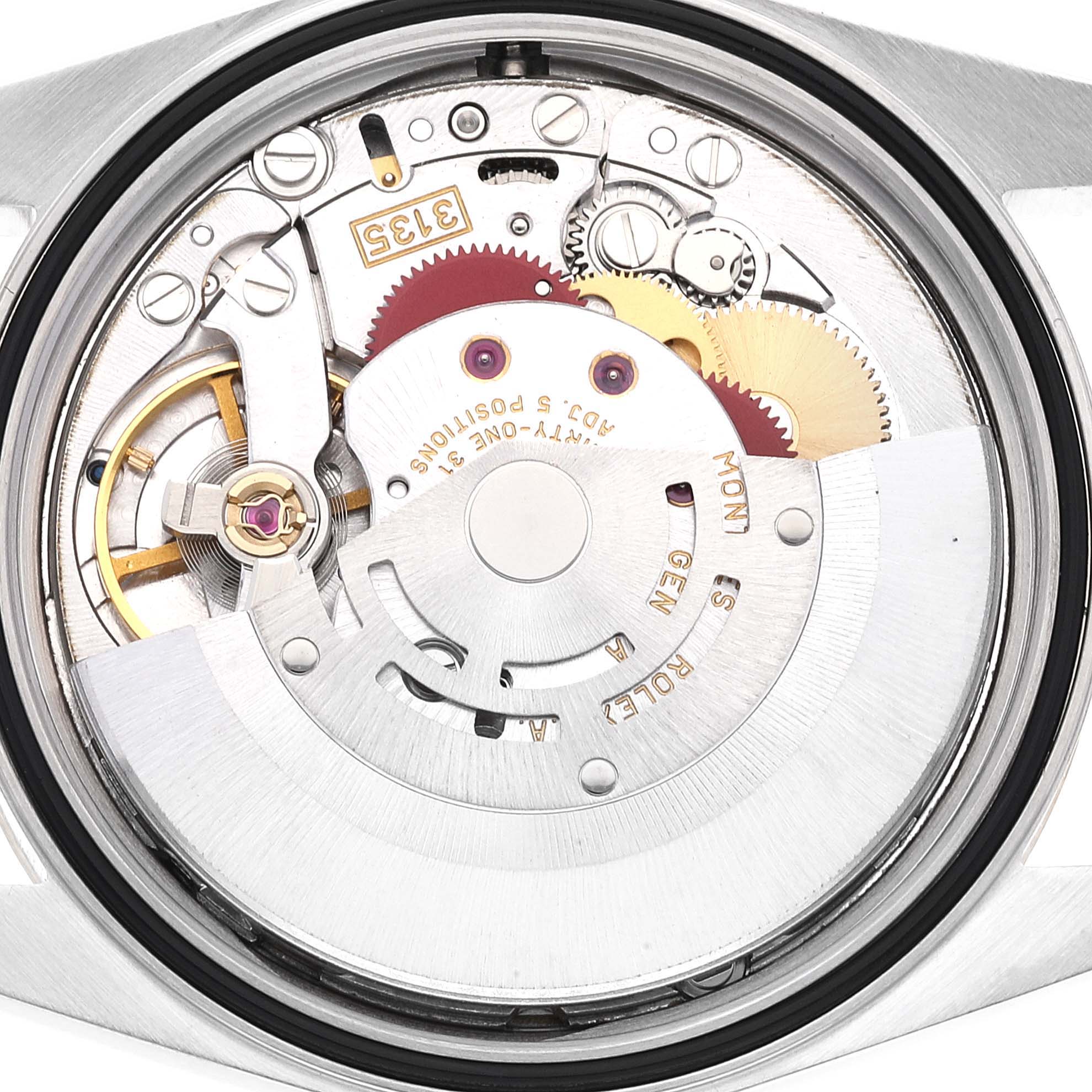 This is a close-up view of the movement mechanism inside a Rolex Datejust 16233 Men's Steel and Gold (two tone) Silver Dial 16233 Men's Steel and Gold (two tone) Silver Dial watch, showing gears and various components.
