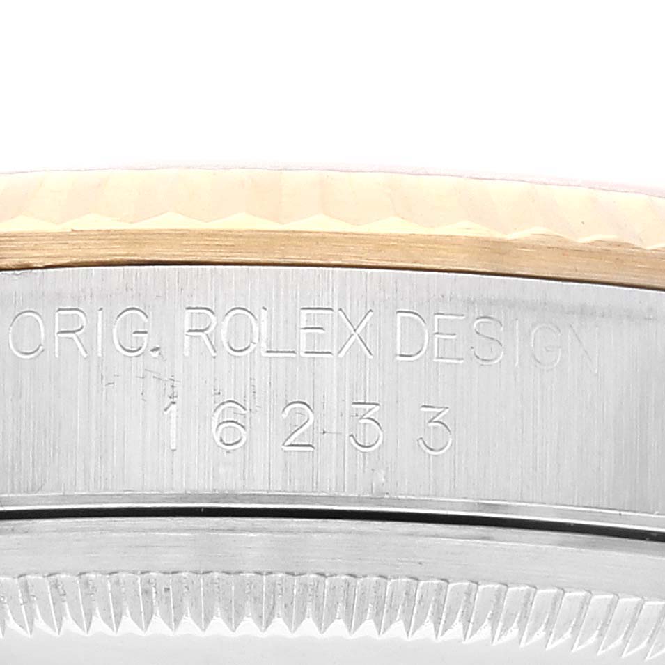 The image shows a close-up of the case side of a Rolex Datejust 16233 Men's Steel and Gold (two tone) Silver Dial 16233 Men's Steel and Gold (two tone) Silver Dial watch, displaying the model number and "ORIG. ROLEX DESIGN" engraving.