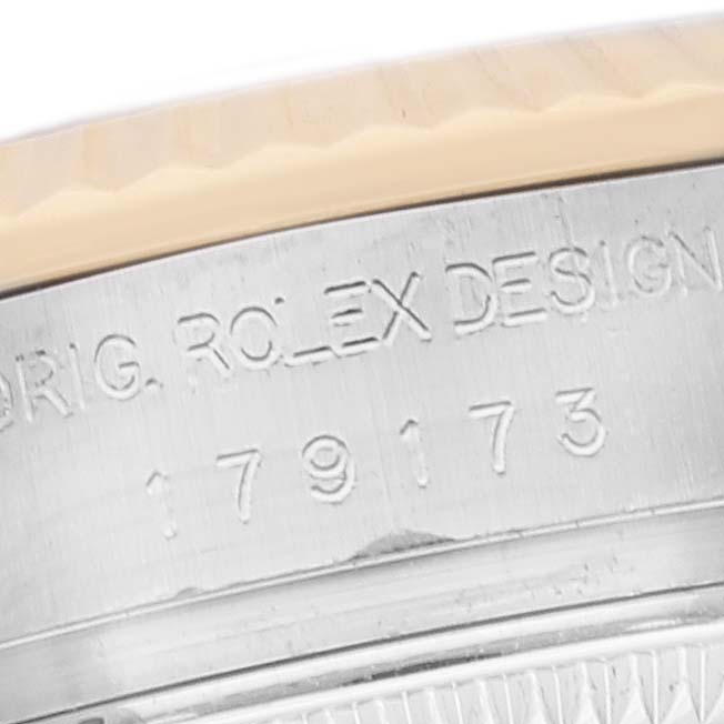 This image shows a close-up of the side of a Rolex Datejust 179173 Women's Steel and Gold (two tone) White Dial 179173 Women's Steel and Gold (two tone) White Dial watch, focusing on the model engraving.