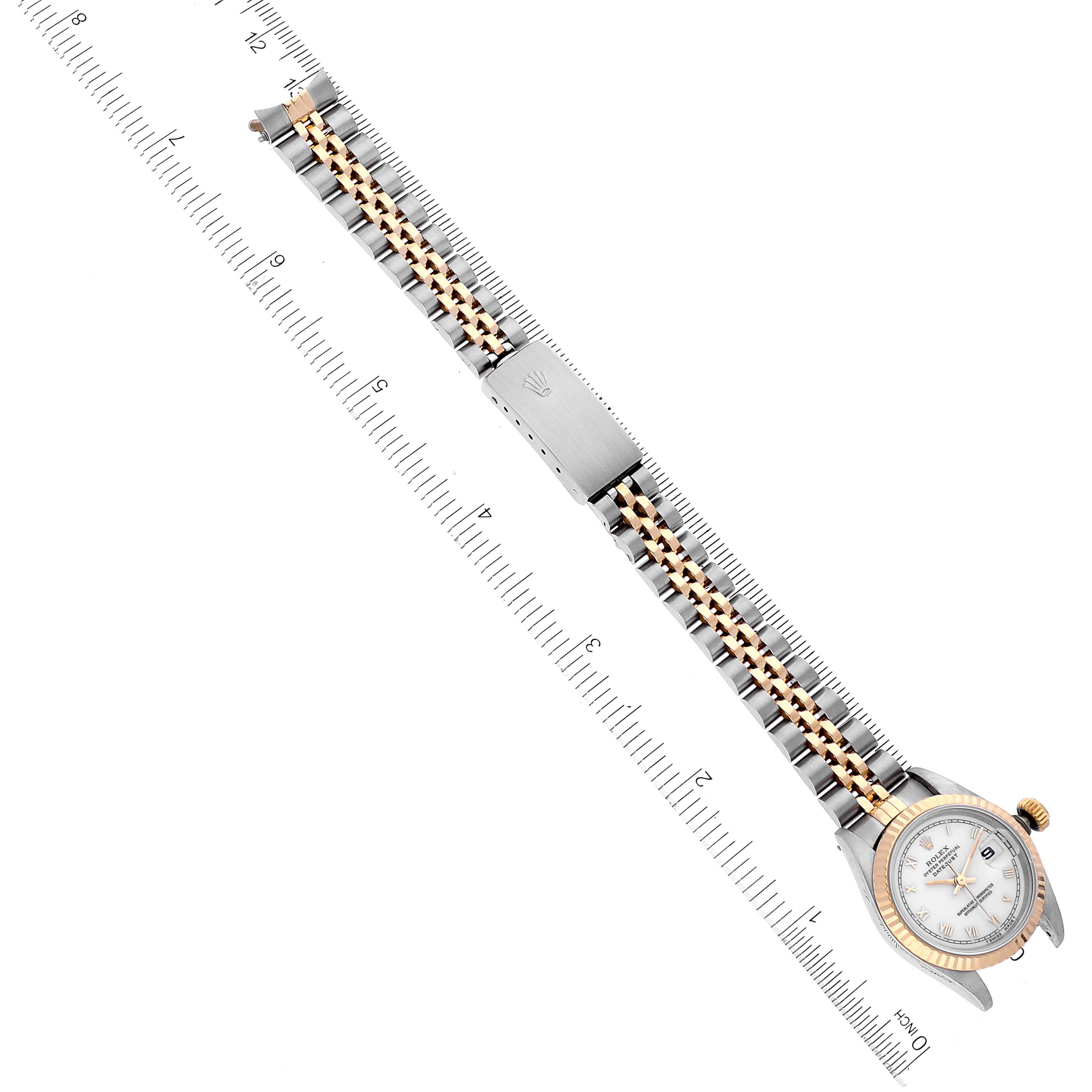 The image shows a Rolex Datejust 69173 Women's Steel and Gold (two tone) White Dial 69173 Women's Steel and Gold (two tone) White Dial watch with a jubilee bracelet, laying flat alongside a ruler for measurement.