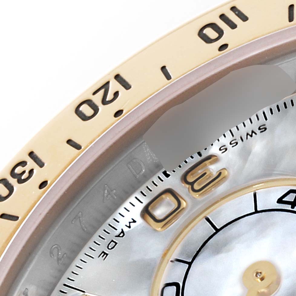 The image shows a close-up of the bezel and partial dial of a Rolex Daytona 116523 Men's Steel and Gold (two tone) Mother of Pearl Dial 116523 Men's Steel and Gold (two tone) Mother of Pearl Dial watch, highlighting the numerals and minute markers.