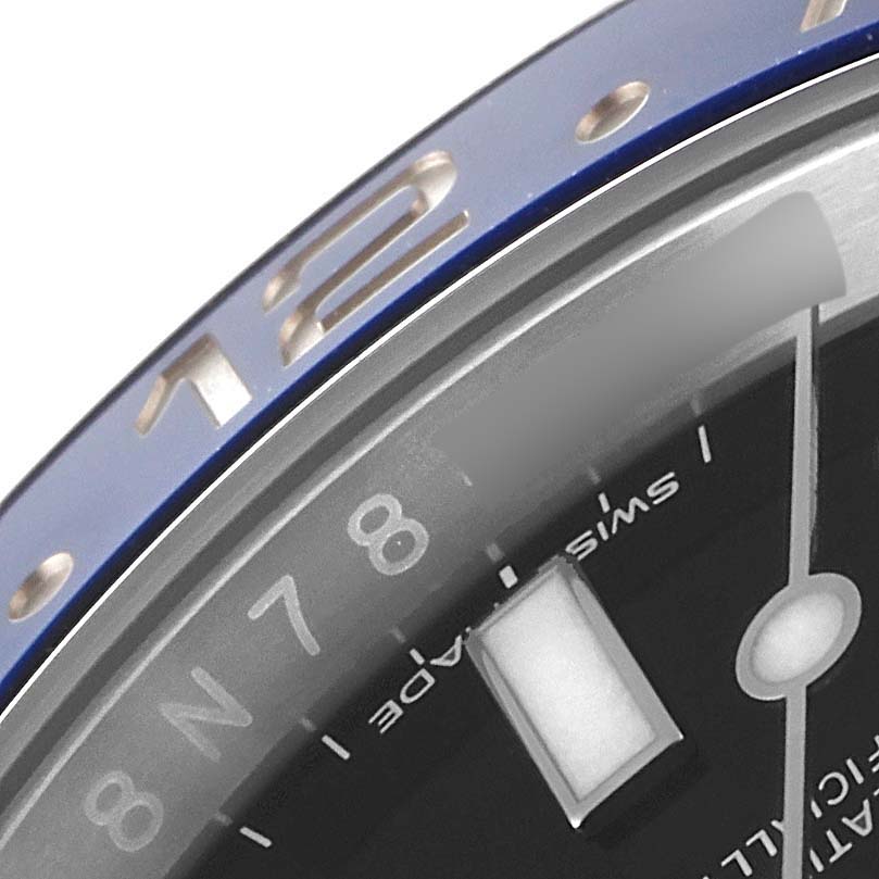 This close-up image shows the Rolex GMT-Master 116710 Men
s Stainless Steel Black Dial 116710 Men
s Stainless Steel Black Dial
s bezel, dial, and hour markings.