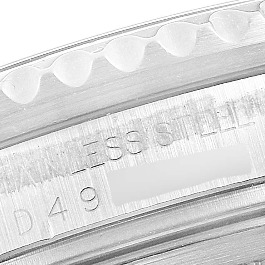 This close-up image shows the engraved inner bezel and part of the outer bezel of a Rolex GMT-Master 16710 Men
s Stainless Steel Black Dial 16710 Men
s Stainless Steel Black Dial watch.