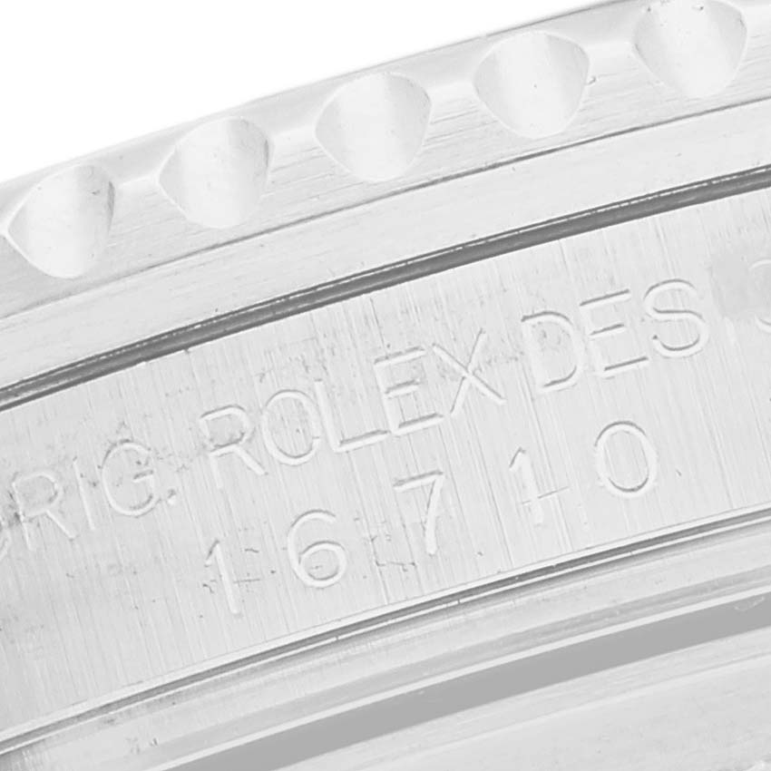 This close-up image shows the engraved case and bezel edge of a Rolex GMT-Master 16710 Men's Stainless Steel Black Dial 16710 Men's Stainless Steel Black Dial watch, model number 16710.