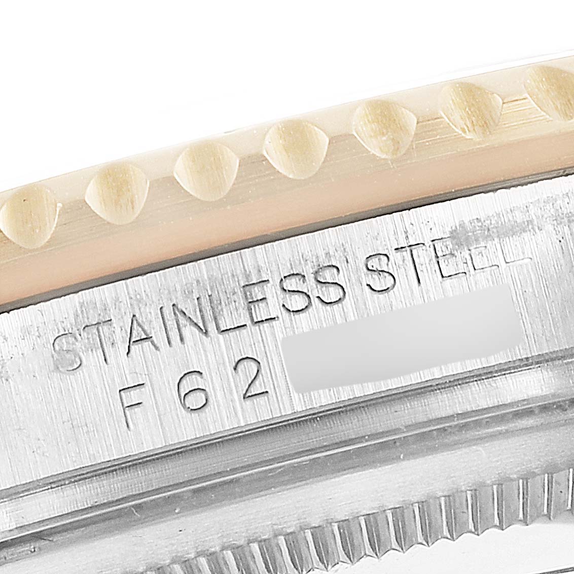 This image shows a close-up of the stainless steel case and bezel of a Rolex GMT-Master 16713 Men's Steel and Gold (two tone) Black Dial 16713 Men's Steel and Gold (two tone) Black Dial watch.