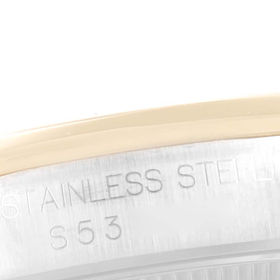 This image shows a close-up of the casing back of a Rolex Mid-Size 67483 Women
s Steel and Gold (two tone) White Dial 67483 Women
s Steel and Gold (two tone) White Dial model, highlighting the "STAINLESS STEEL S53" inscription.