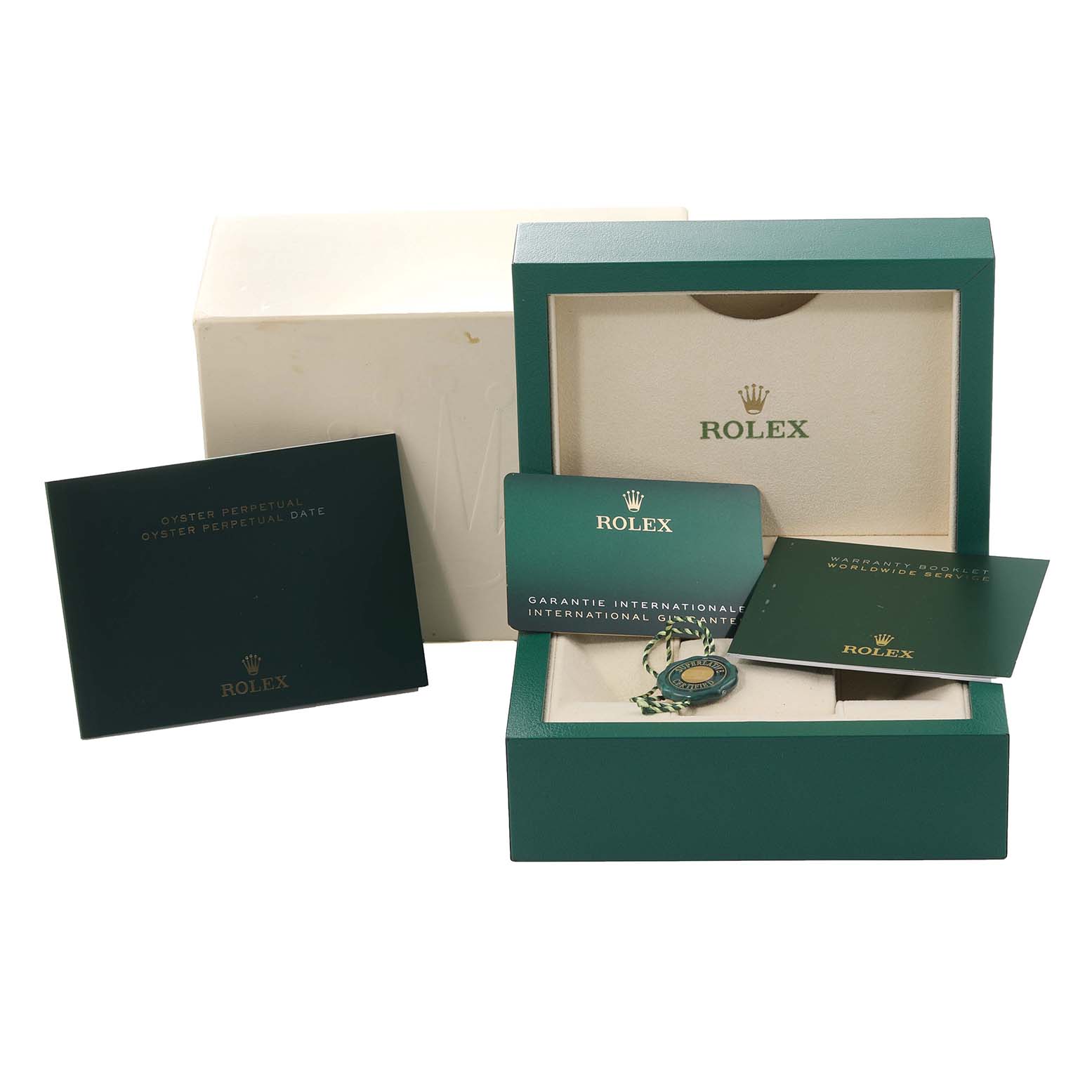 The image shows the packaging, international guarantee, and booklets of a Rolex Oyster Perpetual 116000 Men's Stainless Steel Purple Dial 116000 Men's Stainless Steel Purple Dial watch.