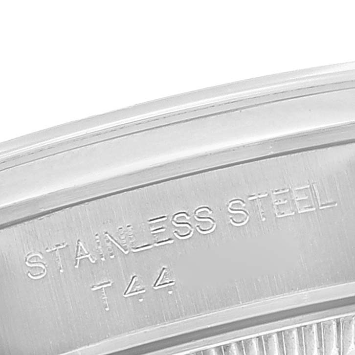 The image shows a close-up of the stainless steel back of a Rolex Oyster Perpetual 67180 Women's Stainless Steel White Dial 67180 Women's Stainless Steel White Dial watch.