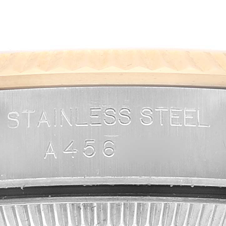 The image shows a close-up of the side of the Rolex Oyster Perpetual 76193 Women's Steel and Gold (two tone) Champagne Dial 76193 Women's Steel and Gold (two tone) Champagne Dial watch, highlighting the stainless steel material and part number A456.