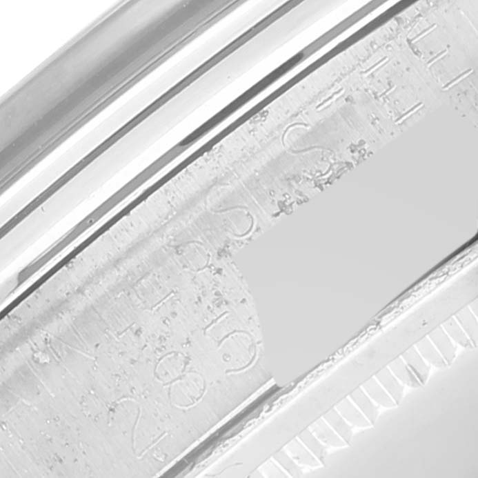 This close-up shows the engraving on the side of the bezel of a Vintage Collection Rolex watch.