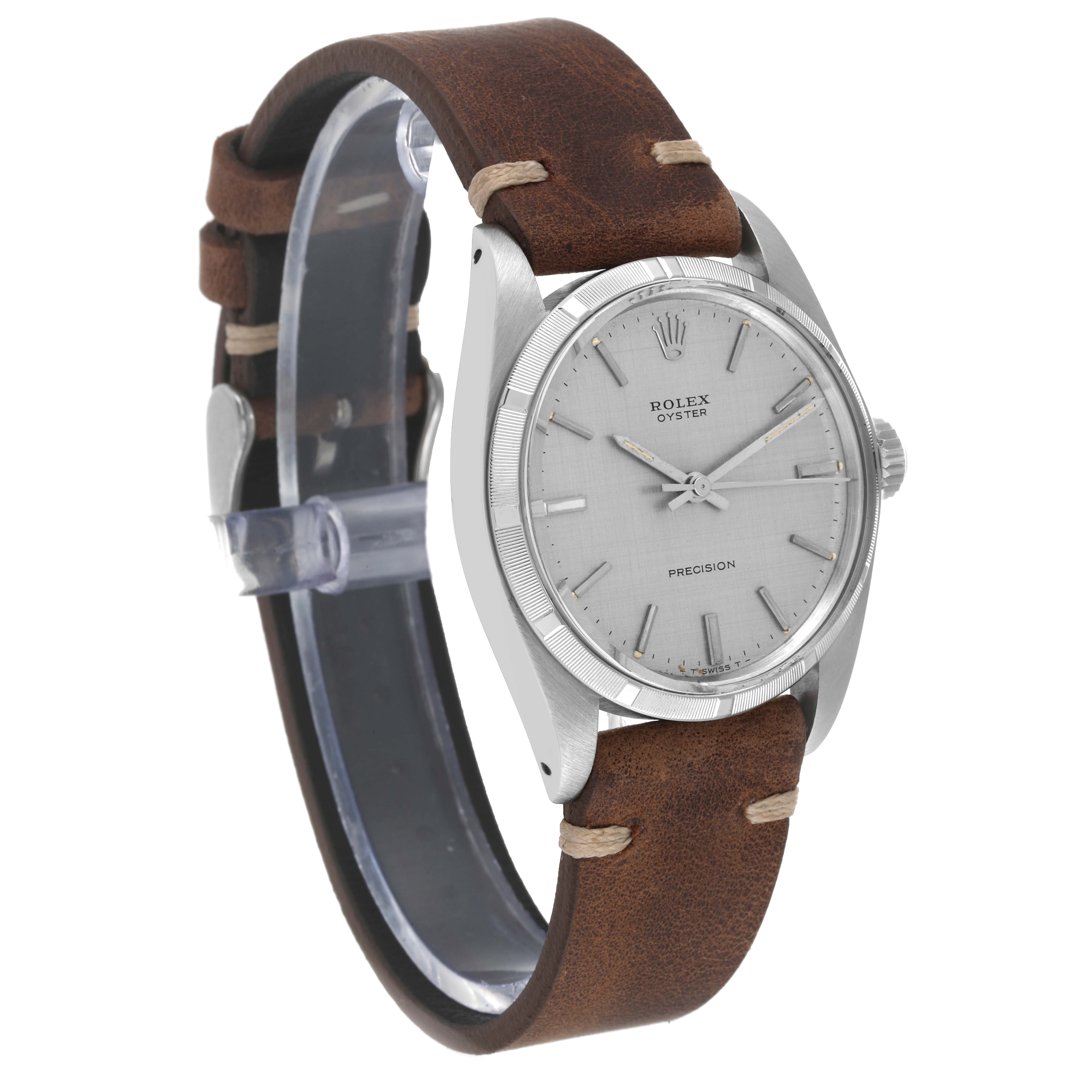 The image shows a Vintage Collection Rolex watch at a three-quarter angle, highlighting the leather strap and silver-toned dial.