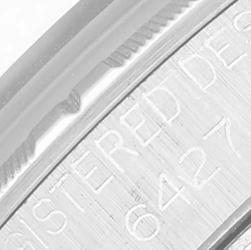 This image shows a close-up of the engraving and edge of the bezel on a Rolex Vintage Collection 6427 Men's Stainless Steel Silver Dial 6427 Men's Stainless Steel Silver Dial model.