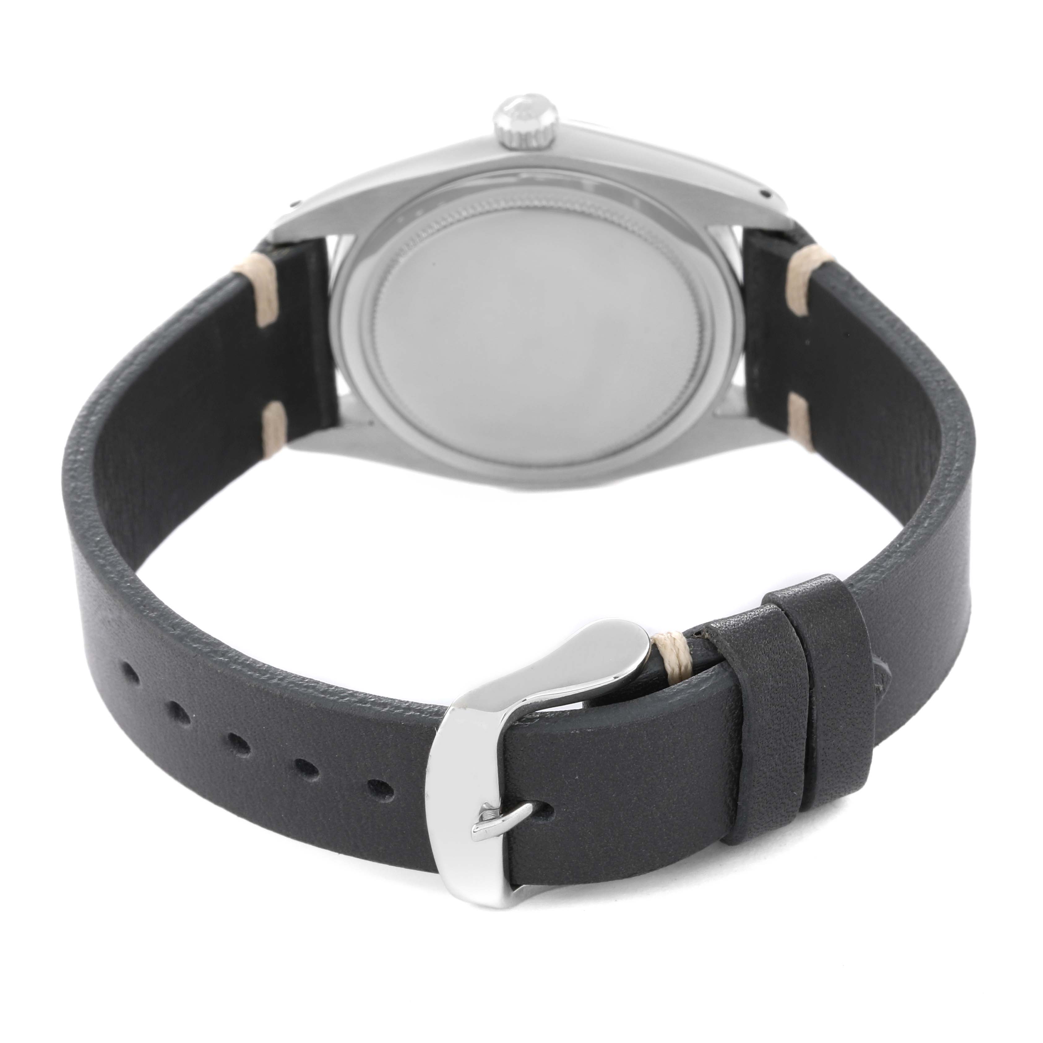 This is a rear view of the Vintage Collection model by Rolex, showing the case back and leather strap.