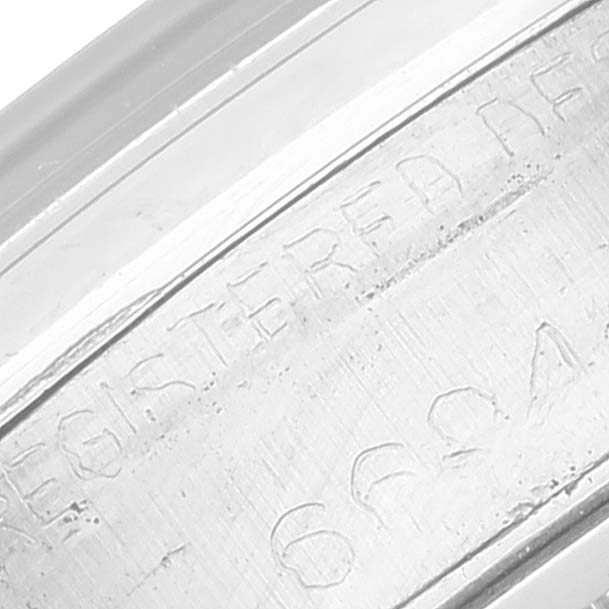 This close-up image shows the engraved text on the inner bezel or case back of the Rolex Vintage Collection 6694 Men's Stainless Steel Black Dial 6694 Men's Stainless Steel Black Dial watch.