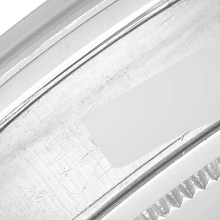 The image shows a close-up of the side of the bezel and caseback of a Vintage Collection model by Rolex.