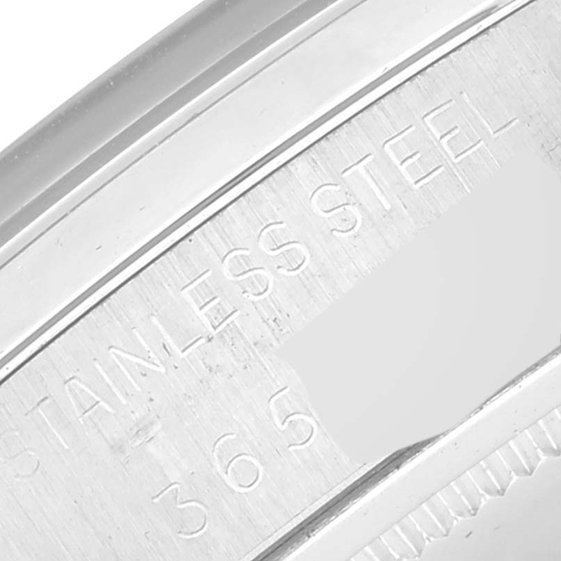 This close-up image shows the stainless steel casing with engravings of the Vintage Collection model watch by Rolex.