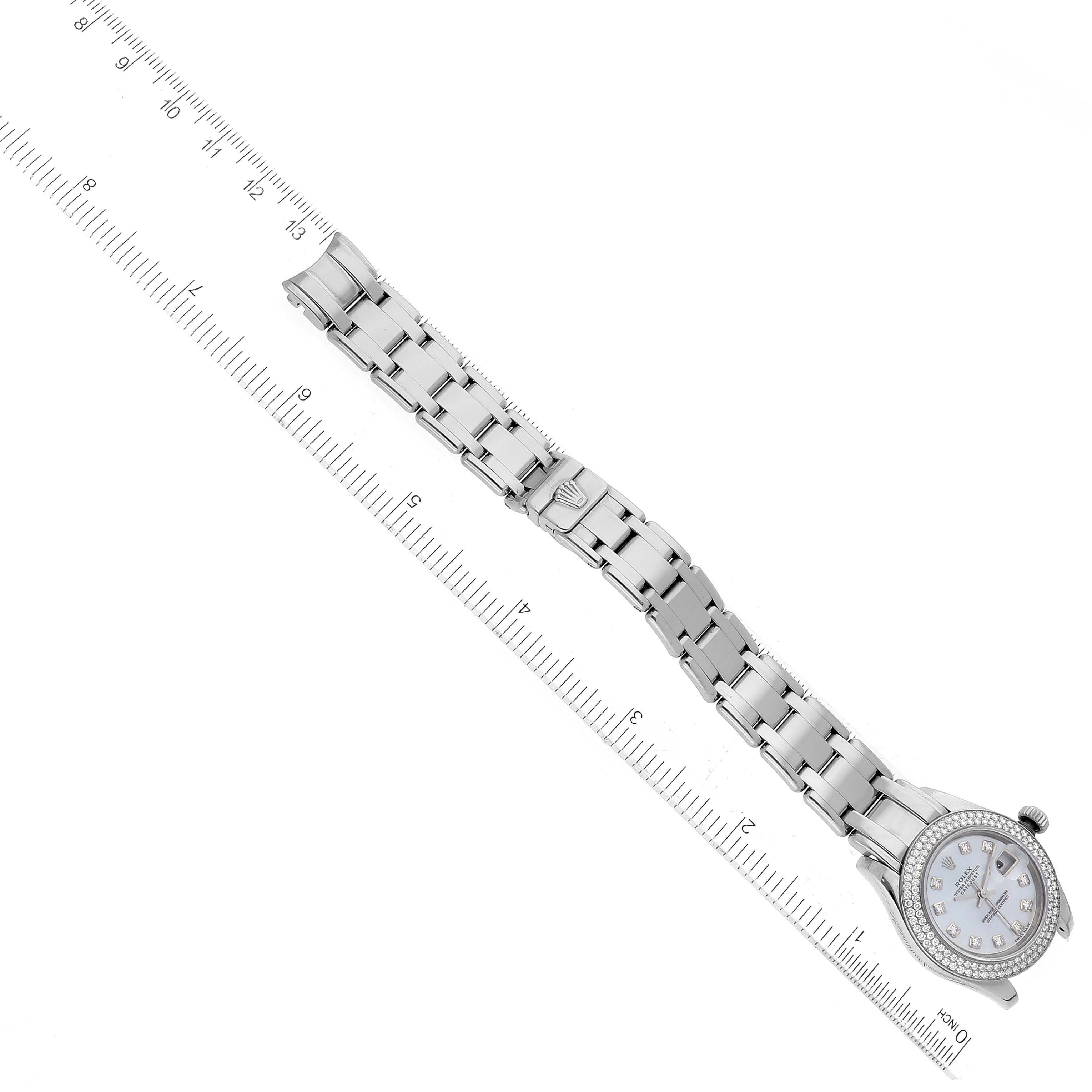 This image shows the Rolex Pearlmaster 80339 Women's White Gold Mother of Pearl Dial 80339 Women's White Gold Mother of Pearl Dial watch laid flat with a ruler for measurement.