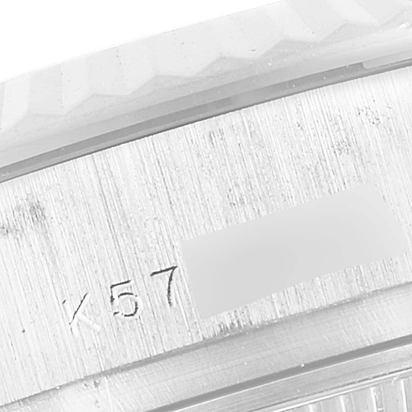 This image shows a close-up of the serial number on the side of a Rolex President 179239 Women's White Gold Mother of Pearl Dial 179239 Women's White Gold Mother of Pearl Dial model watch case.