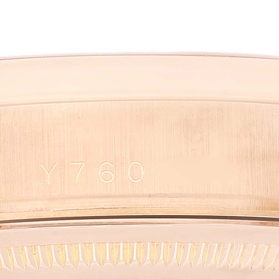 This close-up image shows the case side and part of the bezel of the Rolex President 118205 Men's Rose Gold Silver Dial 118205 Men's Rose Gold Silver Dial watch model, featuring an engraved serial number.
