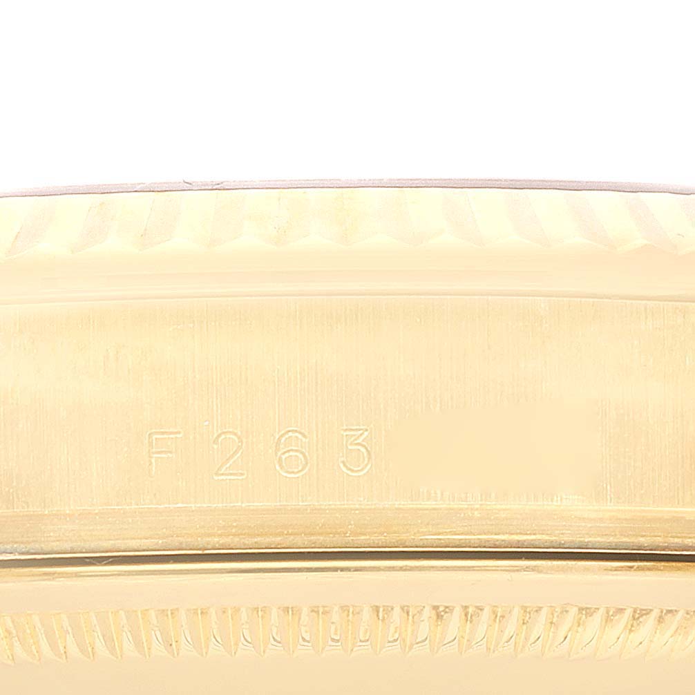 This image shows a close-up of the side engraving and fluted bezel of a Rolex President 118238 Men
s Yellow Gold Champagne Dial 118238 Men
s Yellow Gold Champagne Dial model watch.