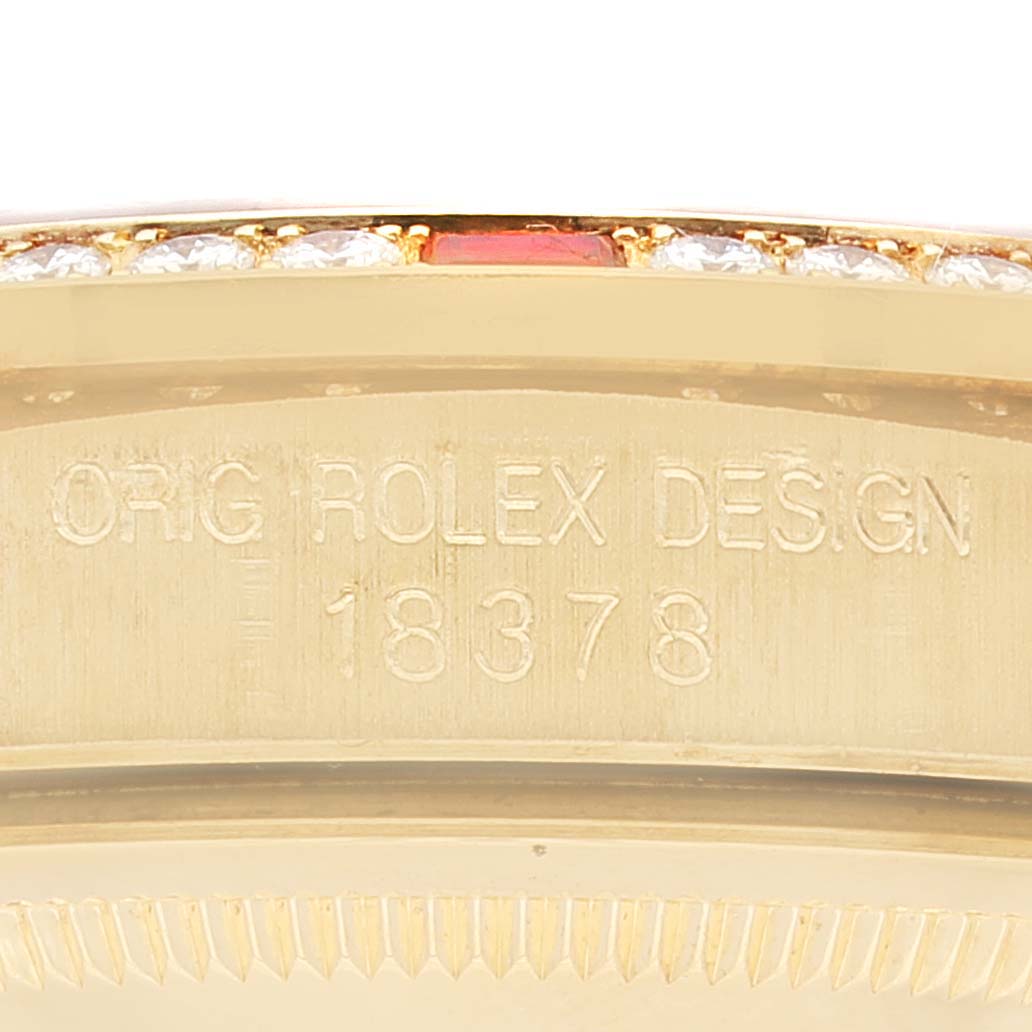 Close-up of the case side of a Rolex President 18378 Men
s Yellow Gold Champagne Dial 18378 Men
s Yellow Gold Champagne Dial model watch, showcasing the "ORIG ROLEX DESIGN" engraving and model number 18378.